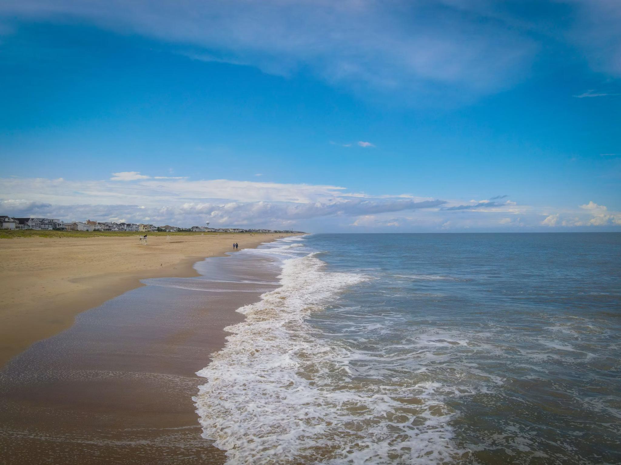A wide, calm stretch of beach at Bethany Beach, Delaware